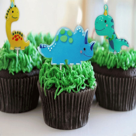 velas de dinossauro em cupcakes