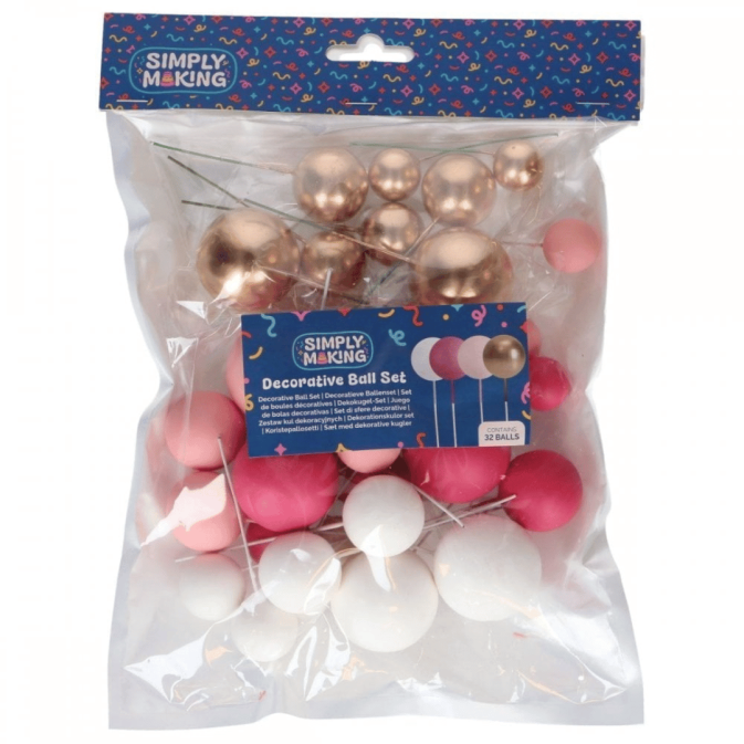 Conjunto de 32 bolas decorativas para bolo nas cores rosa, branco e dourado.